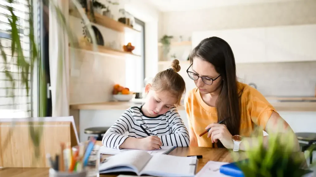 A happy toddler learning emotional intelligence through play and guided interaction with caregivers.